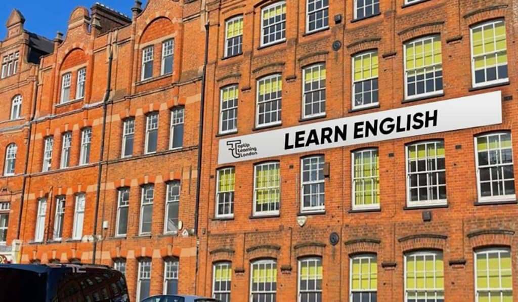 Red-brick building with a Learn English banner at Top Up Learning in London