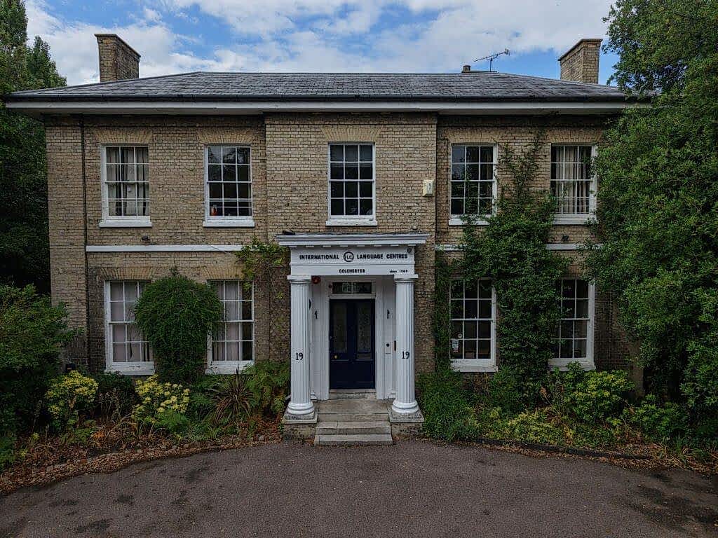 Front of the ILC Colchester building with its driveway and white portico