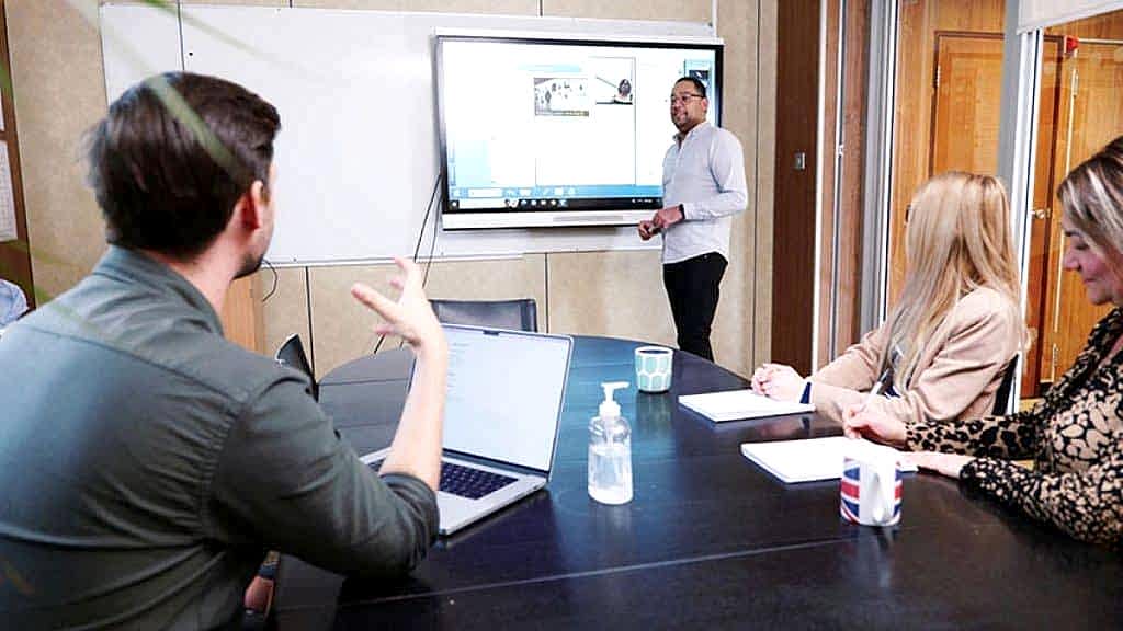 Adult student talking with a teacher in a small class at the Anglo-Continental Executive Centre