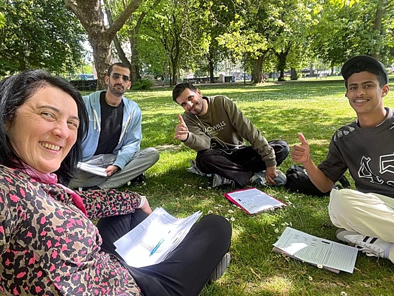 Eurospeak Southampton conversation class sitting on the grass in a park