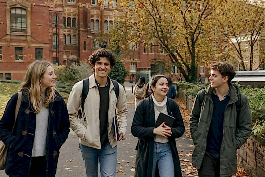 Students walking across a UK university campus