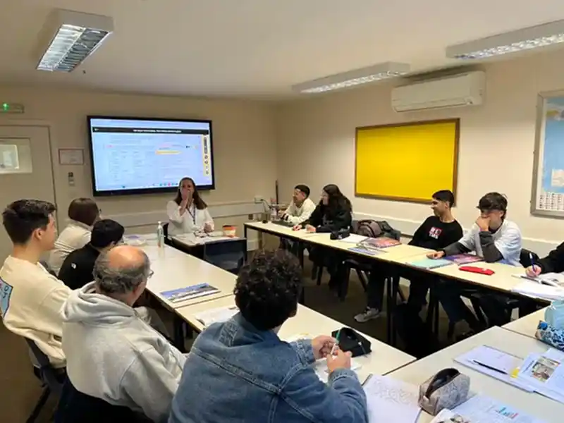 Adult English class with an interactive screen at Southbourne School of English